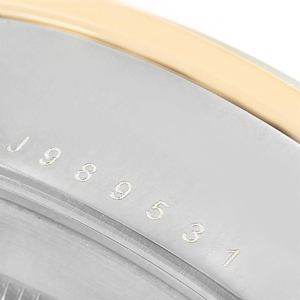 This image shows a close-up of the serial number on the case back of the Tudor Glamour 56003 Men's Steel and Gold (two tone) Champagne Dial 56003 Men's Steel and Gold (two tone) Champagne Dial model watch.