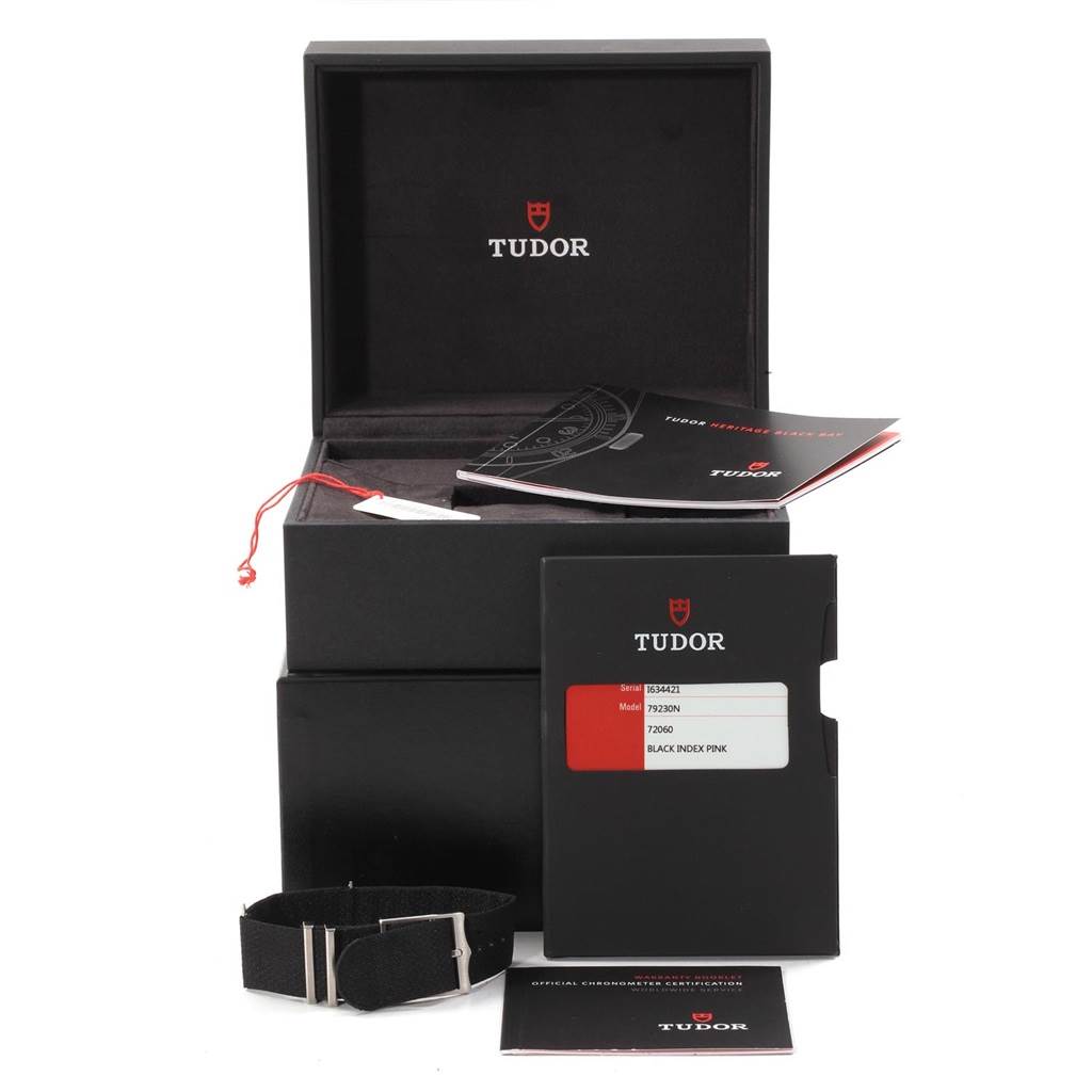 The image shows the packaging, booklet, warranty card, and an additional strap for the Tudor Heritage Black Bay 79230N Men's Stainless Steel Black Dial 79230N Men's Stainless Steel Black Dial watch model.