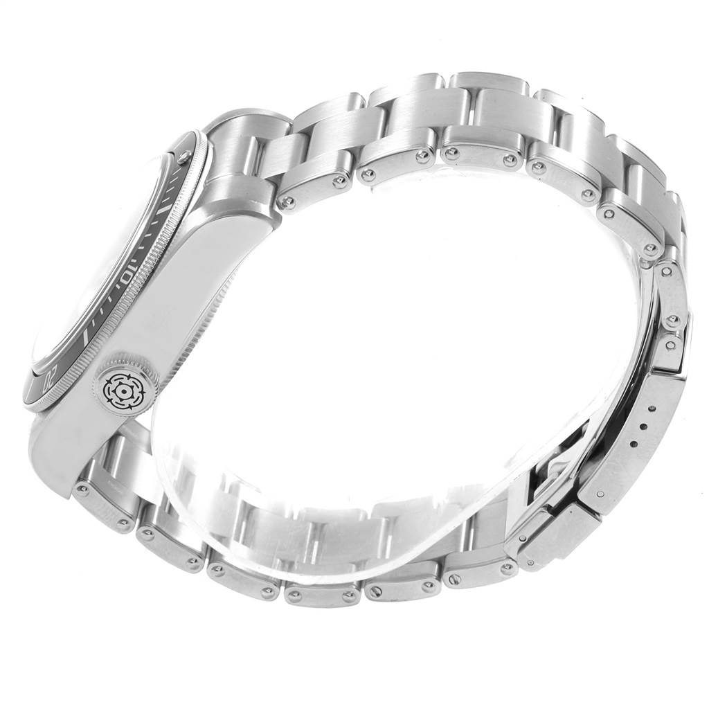 This image shows a side view of the Tudor Heritage Black Bay 79230N Men's Stainless Steel Black Dial 79230N Men's Stainless Steel Black Dial watch, focusing on its case, bezel, and metal bracelet.