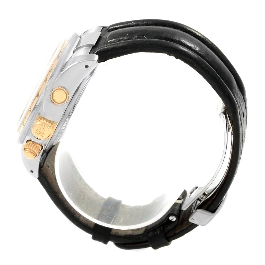 The image shows the Tudor Tiger 79263 Men's Steel and Gold (two tone) White Dial 79263 Men's Steel and Gold (two tone) White Dial model watch from a side angle emphasizing its crown, pushers, and black leather strap.