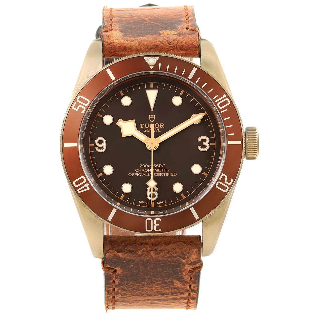 The image shows a front view of the Tudor Heritage Black Bay 79250 Men's Bronze Brown Dial 79250 Men's Bronze Brown Dial watch with a brown dial, bronze bezel, and leather strap.