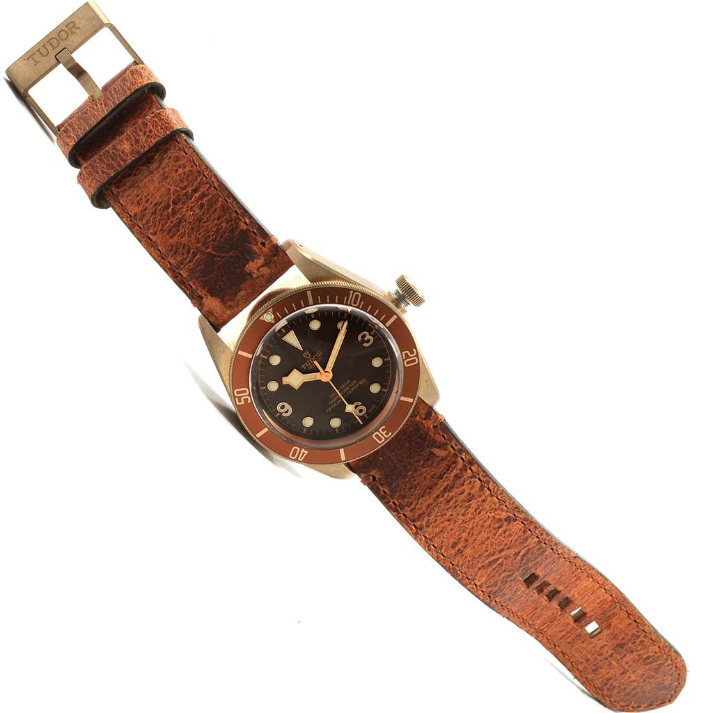 The image shows the Tudor Heritage Black Bay 79250 Men's Bronze Brown Dial 79250 Men's Bronze Brown Dial watch at a slight front angle, highlighting the dial, bezel, and leather strap.