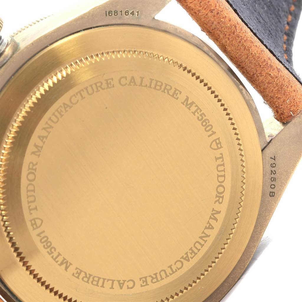 The image shows the back case of a Tudor Heritage Black Bay 79250B Men's Bronze Brown Dial 79250B Men's Bronze Brown Dial watch, displaying the engraved model information and caliber details.