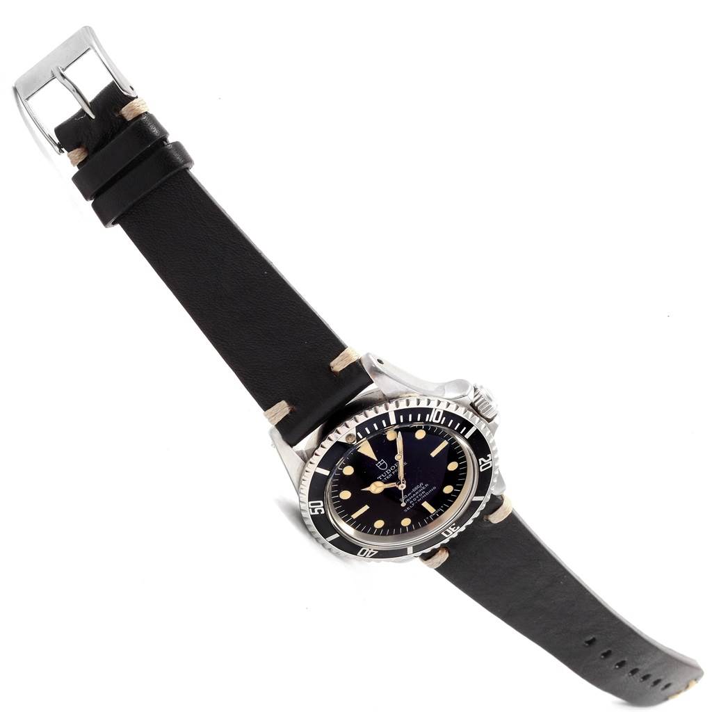 The Tudor Submariner 7928 Men's Stainless Steel Black Dial 7928 Men's Stainless Steel Black Dial watch is shown at an angled top view, displaying the dial, bezel, crown, and strap.