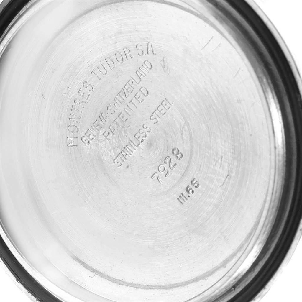 The image shows the inside case back of a Tudor Submariner 7928 Men's Stainless Steel Black Dial 7928 Men's Stainless Steel Black Dial model, displaying markings and model number 7928.