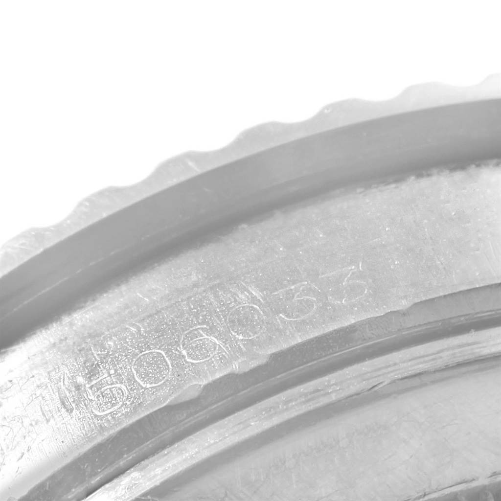 This close-up image of a Tudor Submariner 7928 Men's Stainless Steel Black Dial 7928 Men's Stainless Steel Black Dial model shows the engraved serial number on the watch case.