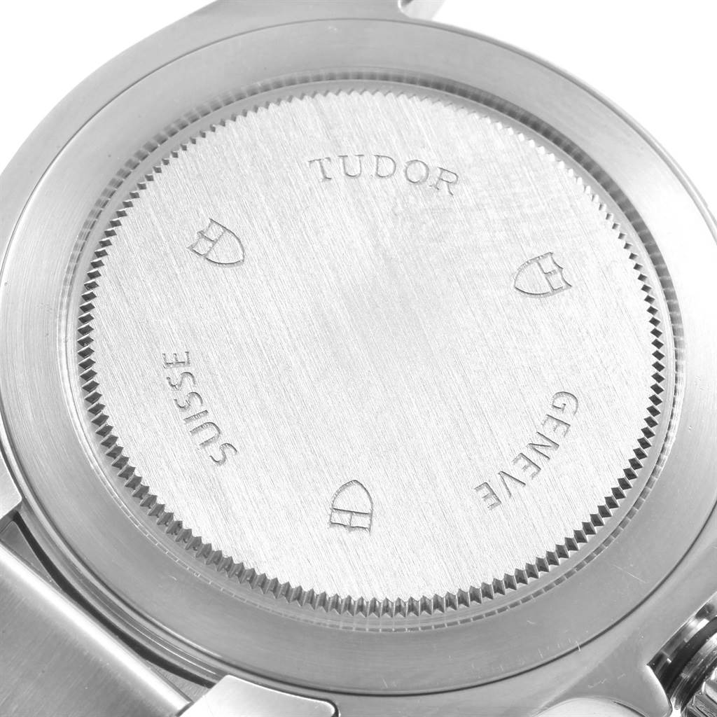 The image shows the stainless steel case back of a Tudor Grantour 20500N Men's Stainless Steel Silver Dial 20500N Men's Stainless Steel Silver Dial watch from a rear angle.