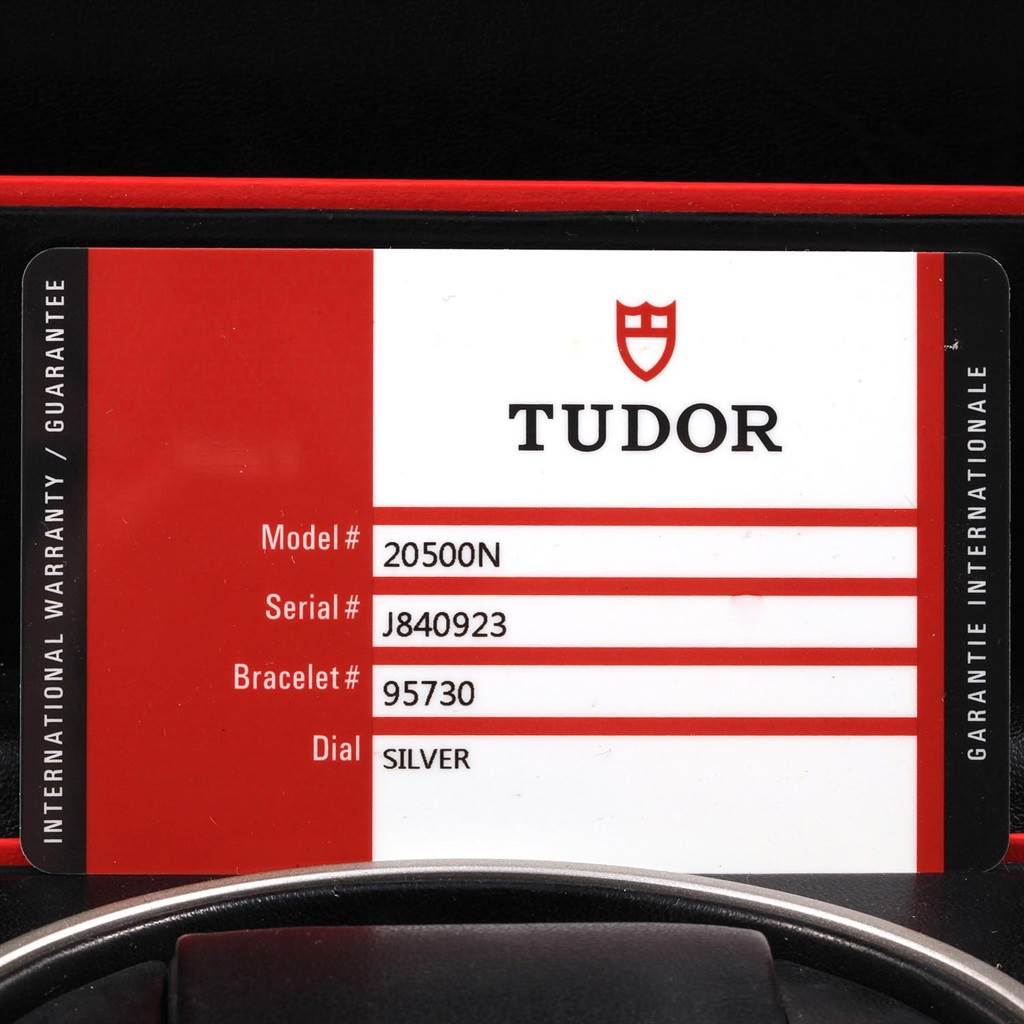 This image shows the Tudory Grantour model warranty card with model and serial numbers, bracelet type, and dial color.