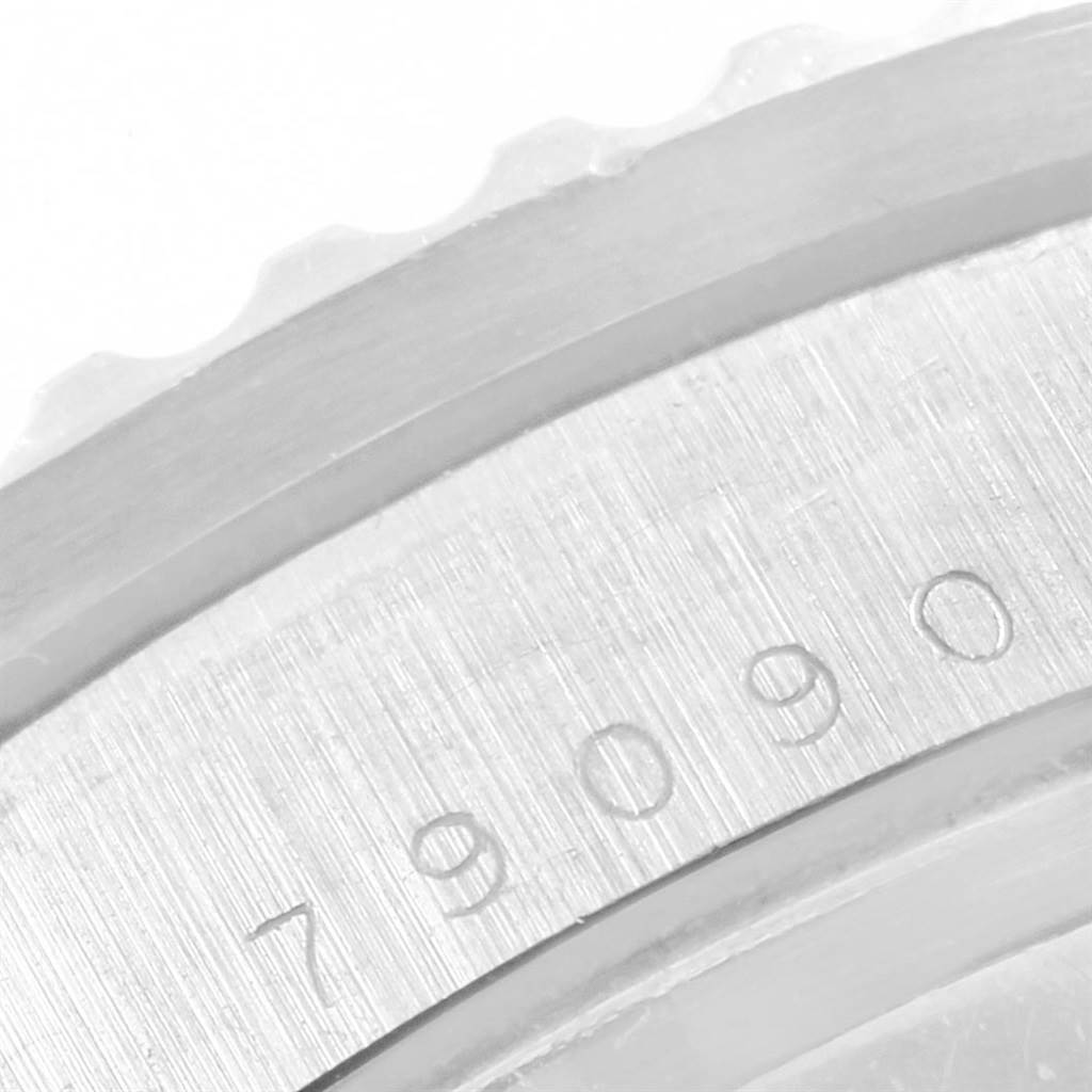 The image shows a close-up of the case back of a Tudor Submariner 79090 Men's Stainless Steel Black Dial 79090 Men's Stainless Steel Black Dial watch with part of the reference number "79090" visible.