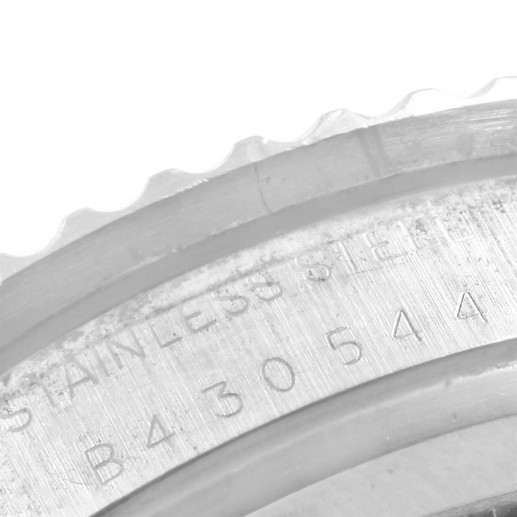 The image shows a close-up of the bezel and part of the case back of a Tudor Submariner 79090 Men's Stainless Steel Black Dial 79090 Men's Stainless Steel Black Dial watch.