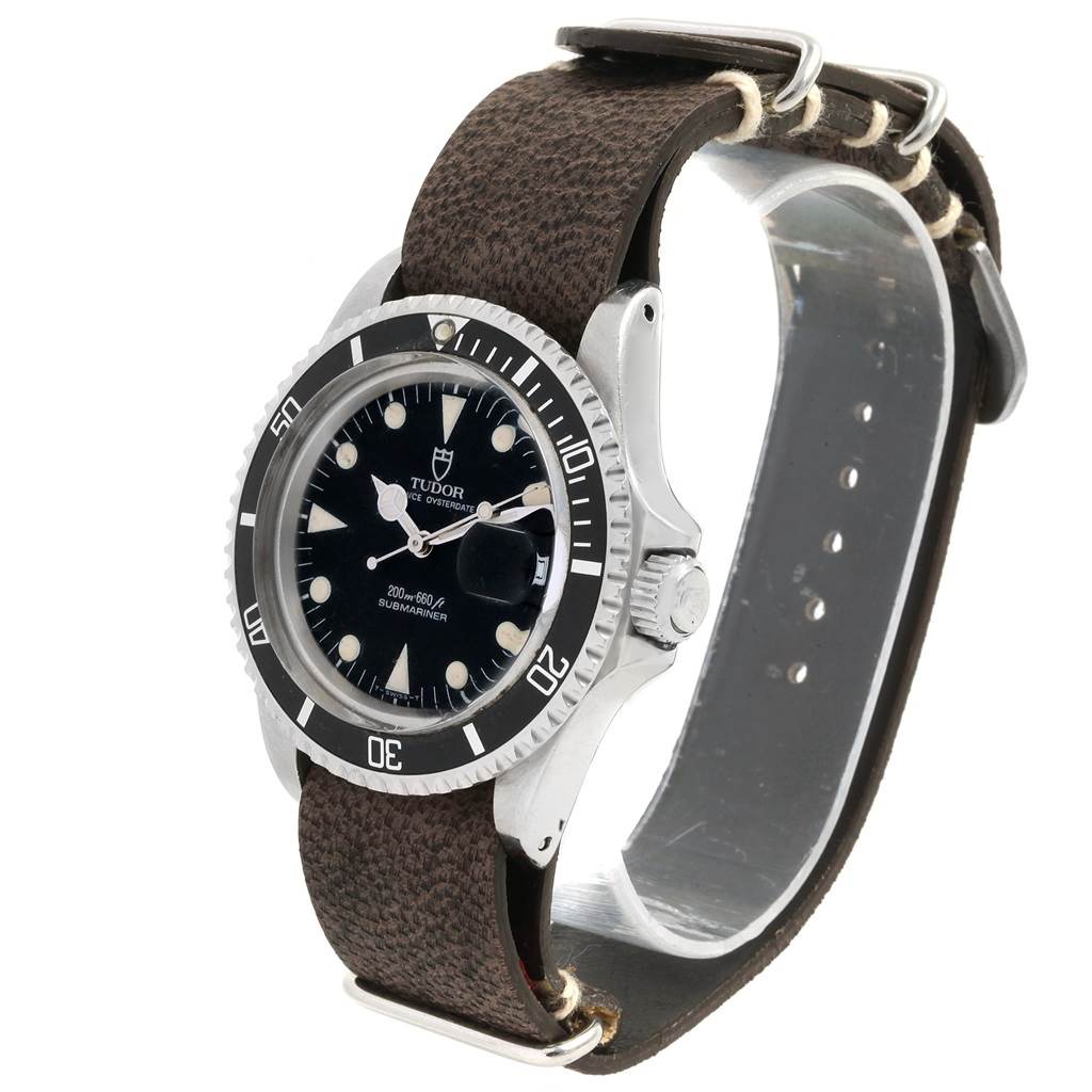 The Tudor Submariner 79090 Men's Stainless Steel Black Dial 79090 Men's Stainless Steel Black Dial watch is shown at a slight angle, highlighting its bezel, dial, and leather strap.