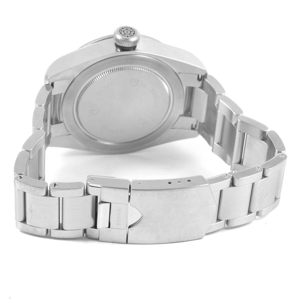 This image shows the back case, crown, and opened clasp of the Tudor Heritage Black Bay 79220 Men's Stainless Steel Black Dial 79220 Men's Stainless Steel Black Dial watch.
