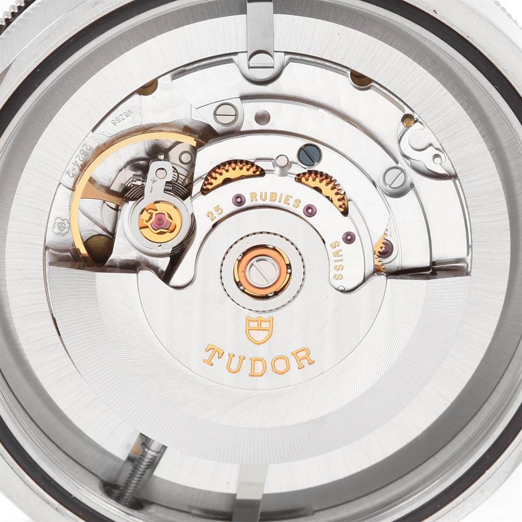 The image shows the inner mechanism of the Tudor Heritage Black Bay 79220 Men's Stainless Steel Black Dial 79220 Men's Stainless Steel Black Dial watch, focused on its movement components.