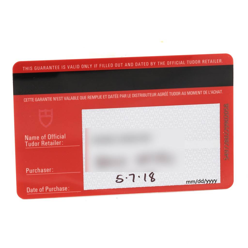 This is a close-up view of the warranty card for a Tudor Heritage Black Bay 79220 Men's Stainless Steel Black Dial 79220 Men's Stainless Steel Black Dial watch.