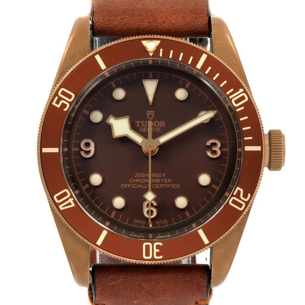 The image shows a front view of the Tudor Heritage Black Bay 79250B Men's Bronze Brown Dial 79250B Men's Bronze Brown Dial watch, highlighting the dial, bezel, and part of the leather strap.