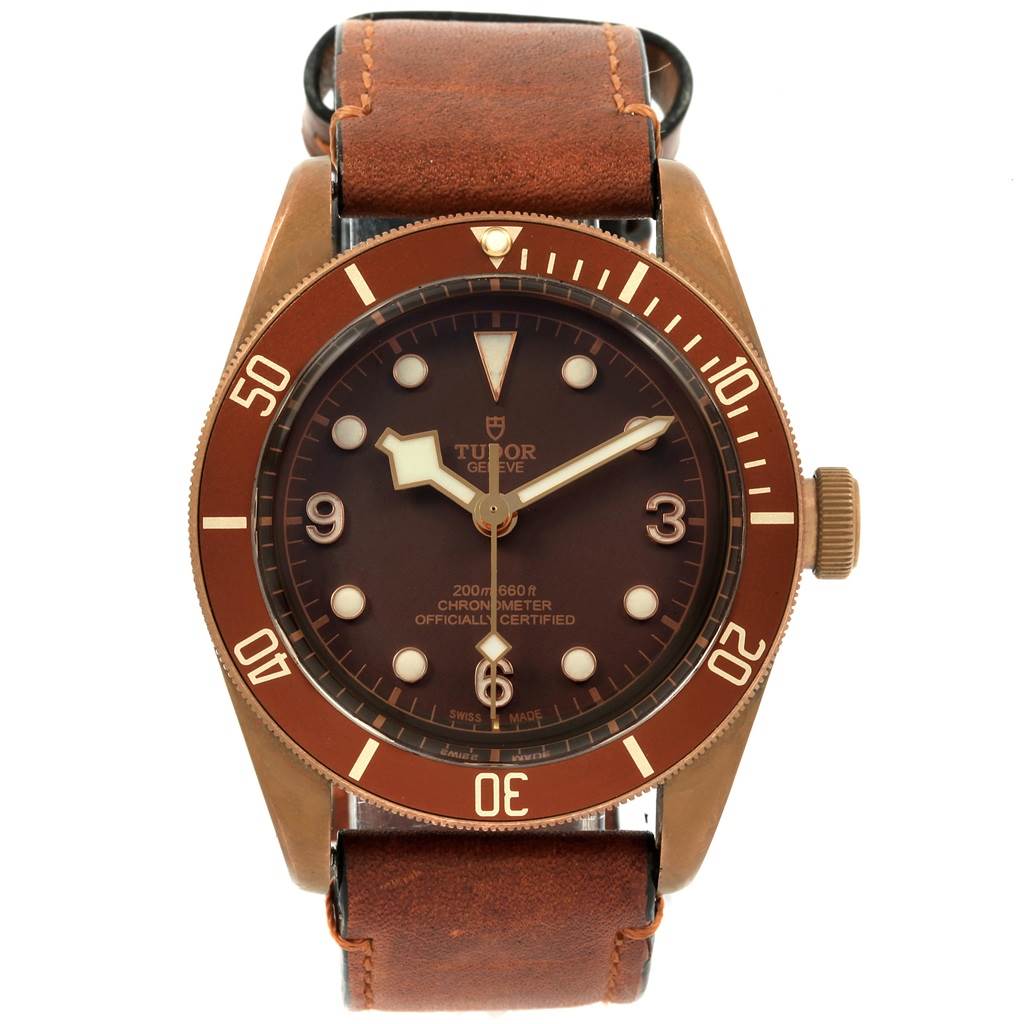 This image shows a front view of the Tudor Heritage Black Bay 79250B Men's Bronze Brown Dial 79250B Men's Bronze Brown Dial watch, highlighting the dial, bezel, and leather strap.