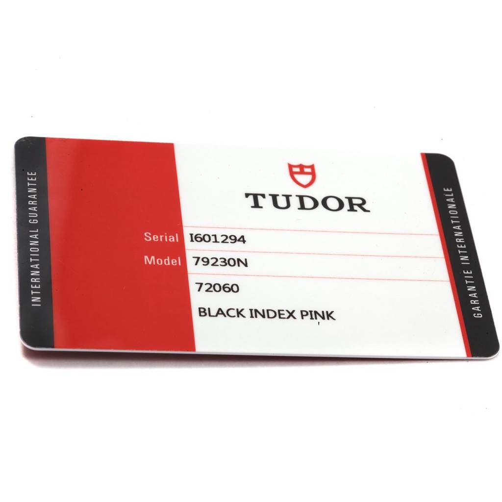 The image shows an international guarantee card for the Tudor Heritage Black Bay 55020 Men's Stainless Steel Black Dial 55020 Men's Stainless Steel Black Dial model 79230N, captured from a top-down angle.
