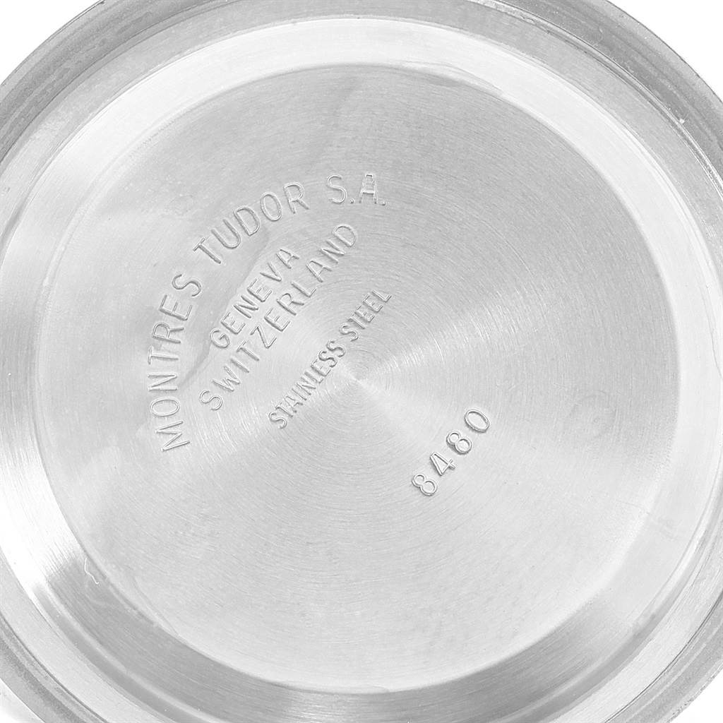 The image shows the caseback of the Tudor Heritage Black Bay 55020 Men's Stainless Steel Black Dial 55020 Men's Stainless Steel Black Dial watch, highlighting its inscriptions and stainless steel material.