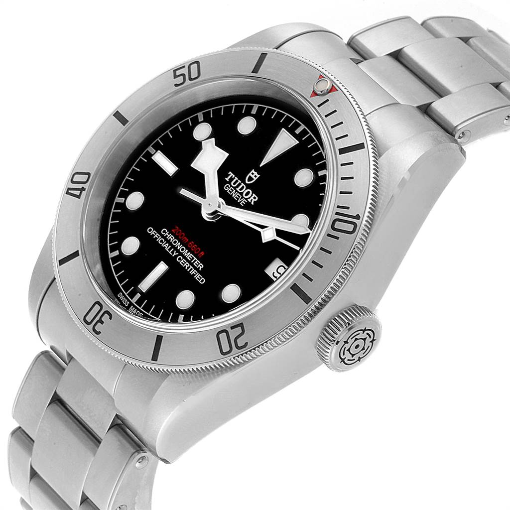 This image shows a close-up of a Tudor Heritage Black Bay 55020 Men's Stainless Steel Black Dial 55020 Men's Stainless Steel Black Dial watch from a 3/4 top-down angle, highlighting the dial, case, bezel, and bracelet.