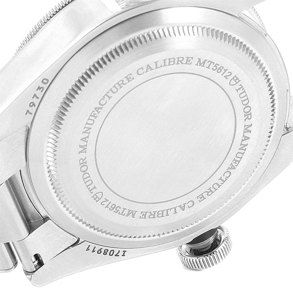 The image shows the case back and part of the bracelet of the Tudor Heritage Black Bay 55020 Men's Stainless Steel Black Dial 55020 Men's Stainless Steel Black Dial watch, highlighting the engraved details of the case back.