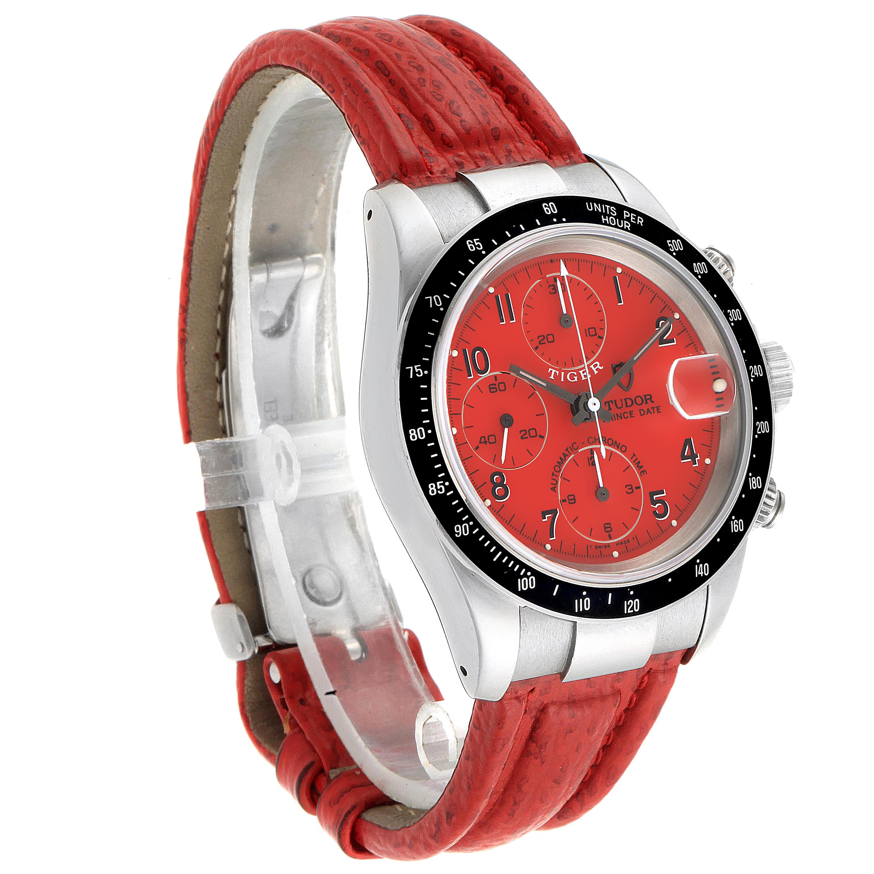 The photo shows a three-quarter view of the Tudor Tiger 79260 Men's Stainless Steel Red Dial 79260 Men's Stainless Steel Red Dial watch, highlighting the red dial, chronograph, and red strap.