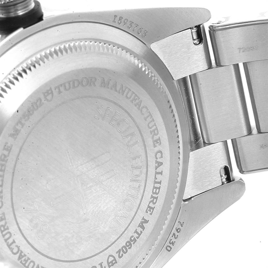 The image shows the case back and part of the bracelet of a Tudor Heritage Black Bay 79230G Men's Stainless Steel Black Dial 79230G Men's Stainless Steel Black Dial watch, highlighting its engravings.