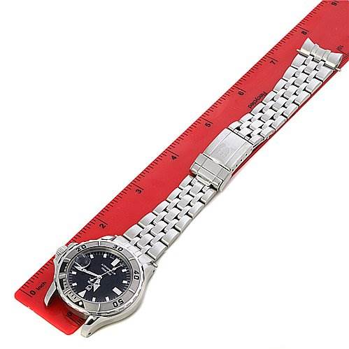 The Tudor Hydronaut 89190 Men's Stainless Steel Black Dial 89190 Men's Stainless Steel Black Dial watch is shown laid flat, with its full bracelet and clasp visible, next to a red ruler for scale.