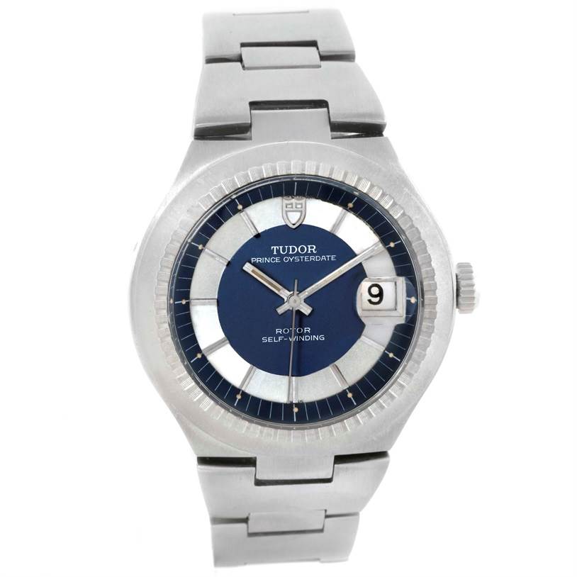 The image shows a Tudor Prince 9101/0 Men's Stainless Steel Silver Dial 9101/0 Men's Stainless Steel Silver Dial Oysterdate watch from a top-down angle, highlighting its dial, bracelet, and bezel.