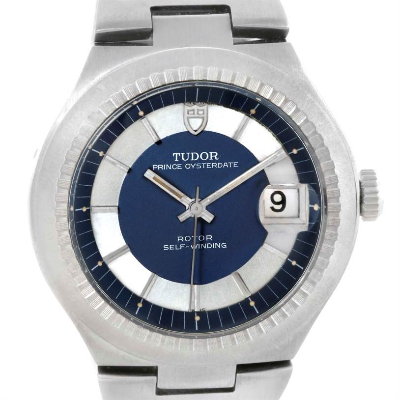 This image shows the face and part of the band of the Tudor Prince 9101/0 Men's Stainless Steel Silver Dial 9101/0 Men's Stainless Steel Silver Dial Oysterdater watch, highlighting its blue dial and date display.