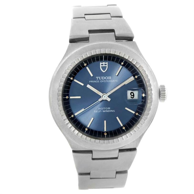 The image shows a front view of a Tudor Prince 9101/0 Men's Stainless Steel Blue Dial 9101/0 Men's Stainless Steel Blue Dial model watch, highlighting its blue dial, date window, and silver bracelet.