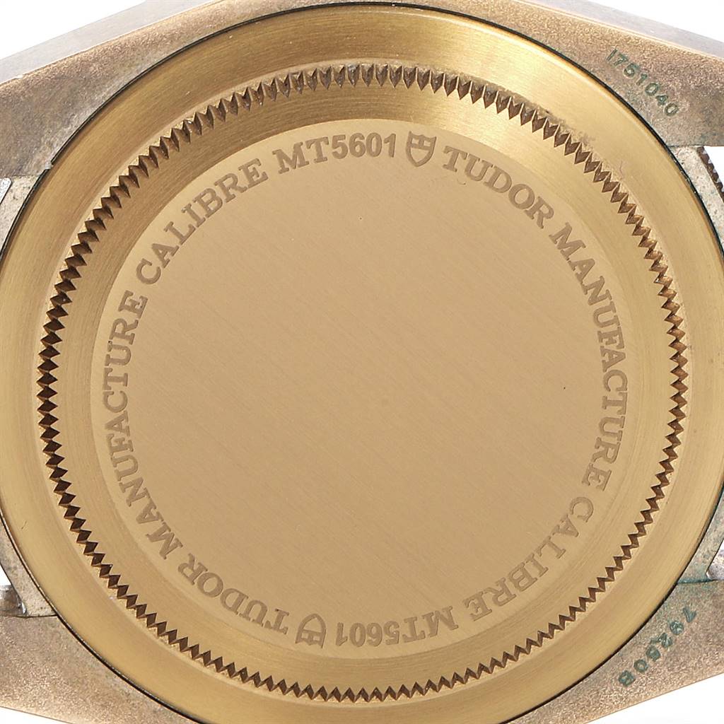 This image shows the case back of a Tudor Heritage Black Bay 79250B Men's Bronze Brown Dial 79250B Men's Bronze Brown Dial watch, highlighting the Tudor Manufacture Calibre MT5601 engraving.