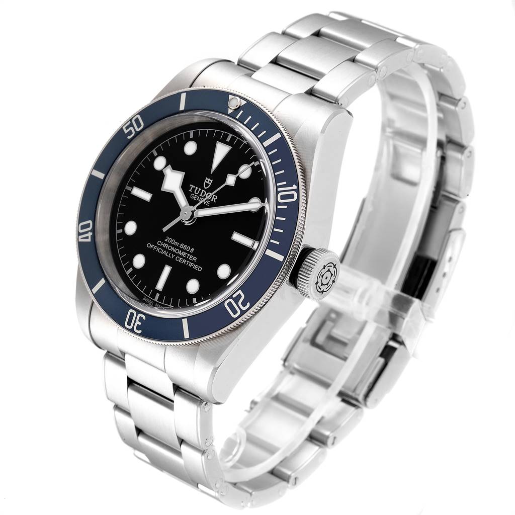 The Tudor Heritage Black Bay 79230B Men
s Stainless Steel Black Dial 79230B Men
s Stainless Steel Black Dial watch is shown at a slight angle, displaying its face, crown, and metal bracelet.