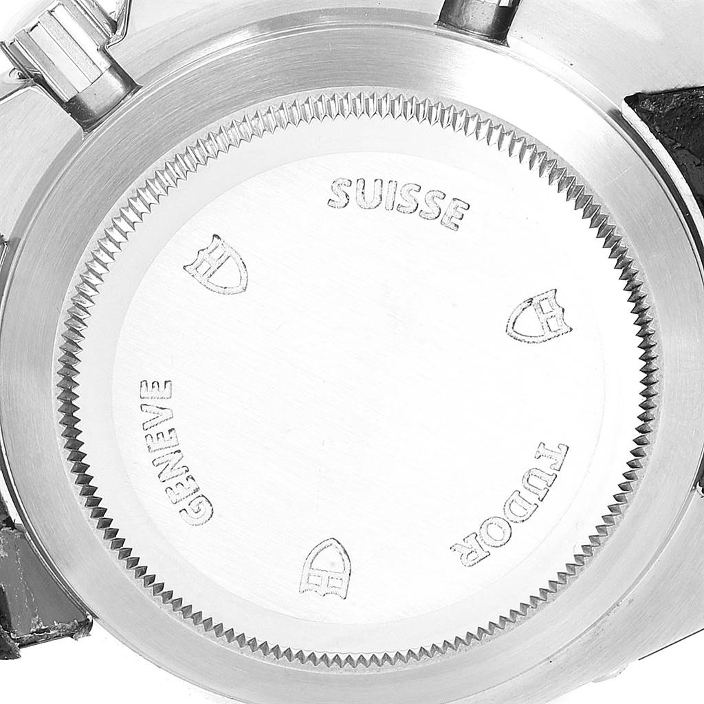 The image shows the back case of a Tudor Grantour 20350N-BKSLPL Men
s Stainless Steel Black Dial 20350N-BKSLPL Men
s Stainless Steel Black Dial watch from an angled close-up view.