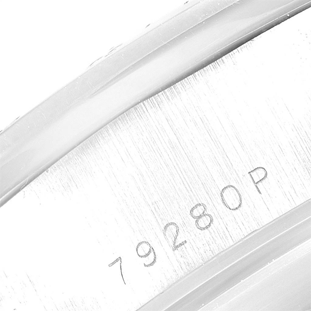 This close-up image shows the serial number engraved on the case back of a Tudor Tiger 79280P Men's Stainless Steel Silver Dial 79280P Men's Stainless Steel Silver Dial model watch.
