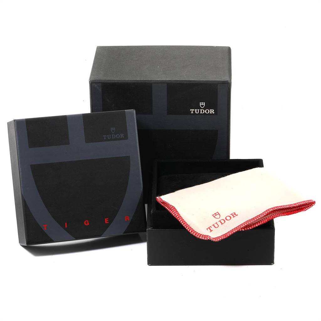 The image shows the packaging, a box, and a cloth for the Tudor Tiger 79280P Men's Stainless Steel Silver Dial 79280P Men's Stainless Steel Silver Dial model watch.