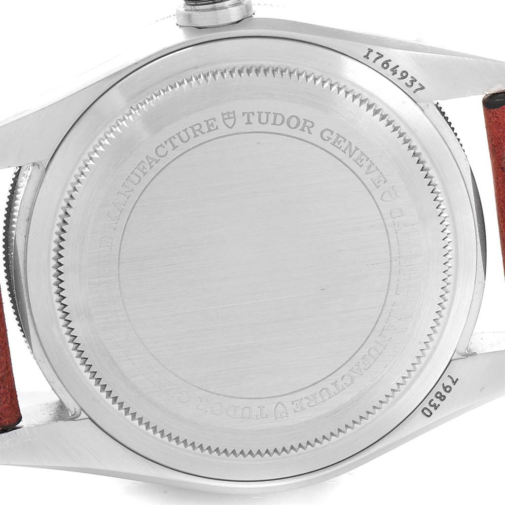 This image shows the back case of a Tudor Heritage Black Bay 79830RB Men's Stainless Steel Black Dial 79830RB Men's Stainless Steel Black Dial watch, highlighting its serial number and engraved branding.