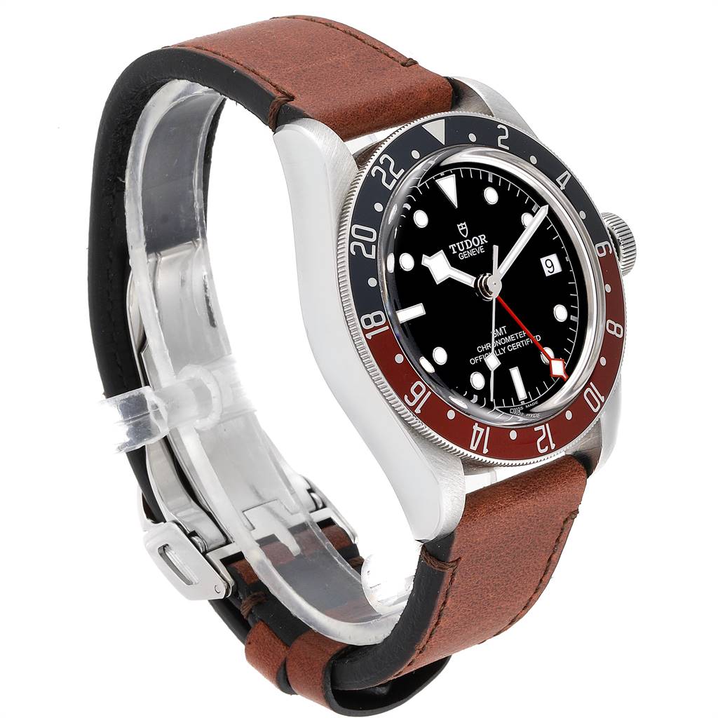 The image shows a side-angle view of a Tudor Heritage Black Bay 79830RB Men's Stainless Steel Black Dial 79830RB Men's Stainless Steel Black Dial watch with a leather strap and a red and black bezel.