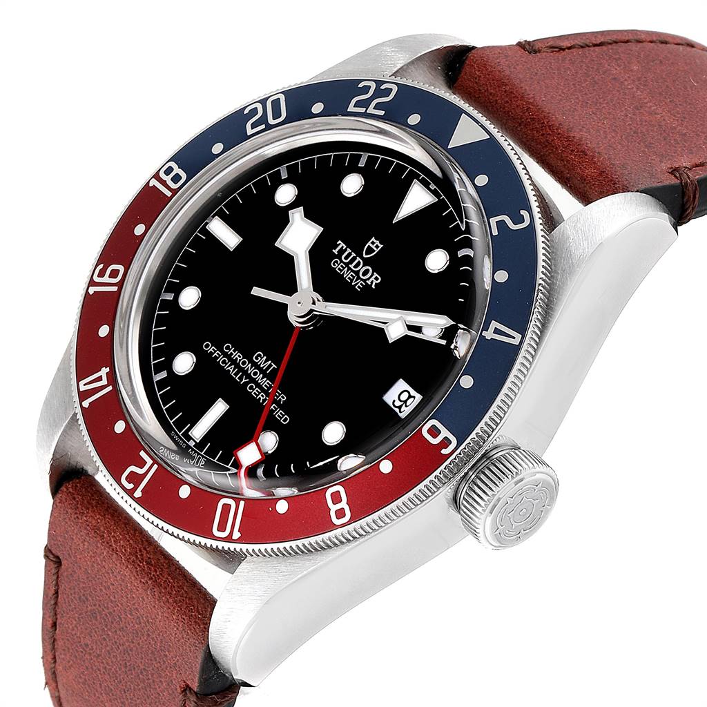 The Tudor Heritage Black Bay 79830RB Men's Stainless Steel Black Dial 79830RB Men's Stainless Steel Black Dial watch is shown at an angle highlighting the bezel, face, crown, and leather strap.