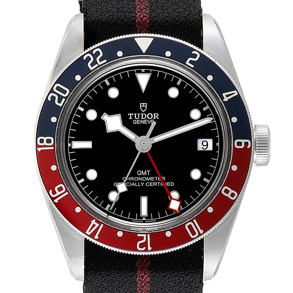 The Tudor Heritage Black Bay 79830RB Men's Stainless Steel Black Dial 79830RB Men's Stainless Steel Black Dial watch is shown from a front angle, displaying the dial, bezel, and partial strap.