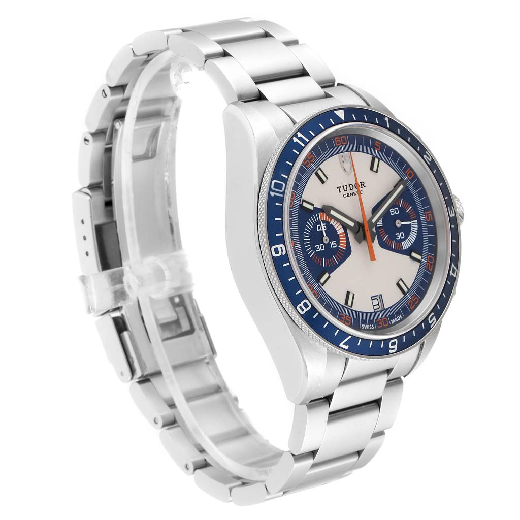 This image shows a Tudor Heritage Chrono 70330B Men
s Stainless Steel Blue Dial 70330B Men
s Stainless Steel Blue Dial watch from a left-side angle, highlighting its bezel, dial, and stainless steel bracelet.