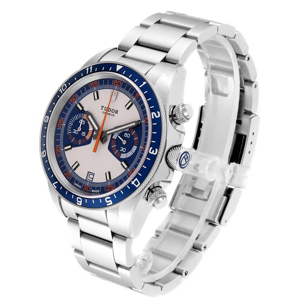 The image shows a Tudor Heritage Chrono 70330B Men
s Stainless Steel Blue Dial 70330B Men
s Stainless Steel Blue Dial watch at an angled view, displaying the dial, crown, pushers, and bracelet.