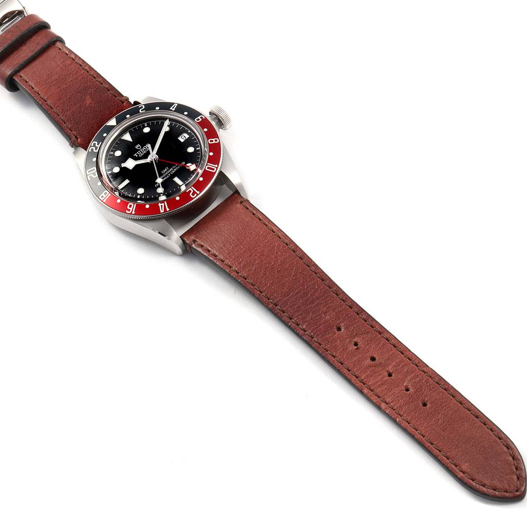 This image shows a Tudor Heritage Black Bay 79830RB Men's Stainless Steel Black Dial 79830RB Men's Stainless Steel Black Dial watch at an angled top view, highlighting the case, bezel, dial, and leather strap.