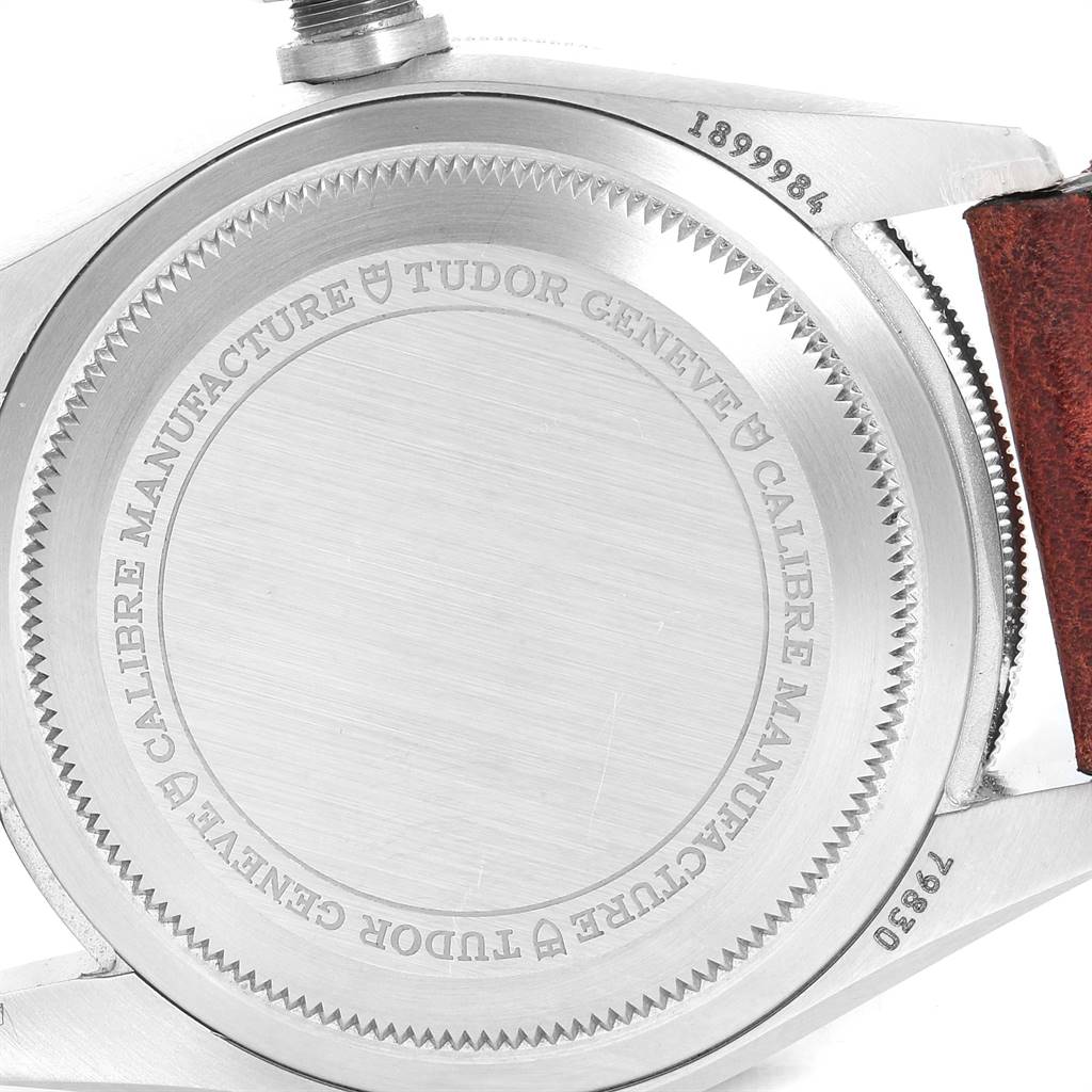 The image shows the case back of a Tudor Heritage Black Bay 79830RB Men's Stainless Steel Black Dial 79830RB Men's Stainless Steel Black Dial watch, highlighting the engraved branding and serial number.