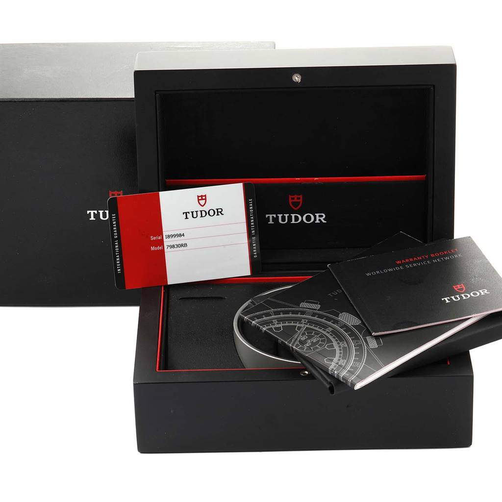 The image shows the Tudor Heritage Black Bay 79830RB Men's Stainless Steel Black Dial 79830RB Men's Stainless Steel Black Dial watch box, warranty card, and associated booklets.