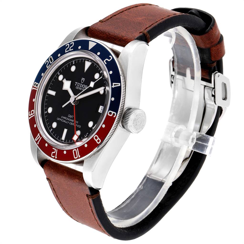 The Tudor Heritage Black Bay 79830RB Men's Stainless Steel Black Dial 79830RB Men's Stainless Steel Black Dial watch is shown at an angle highlighting its bezel, dial, case, crown, and leather strap.