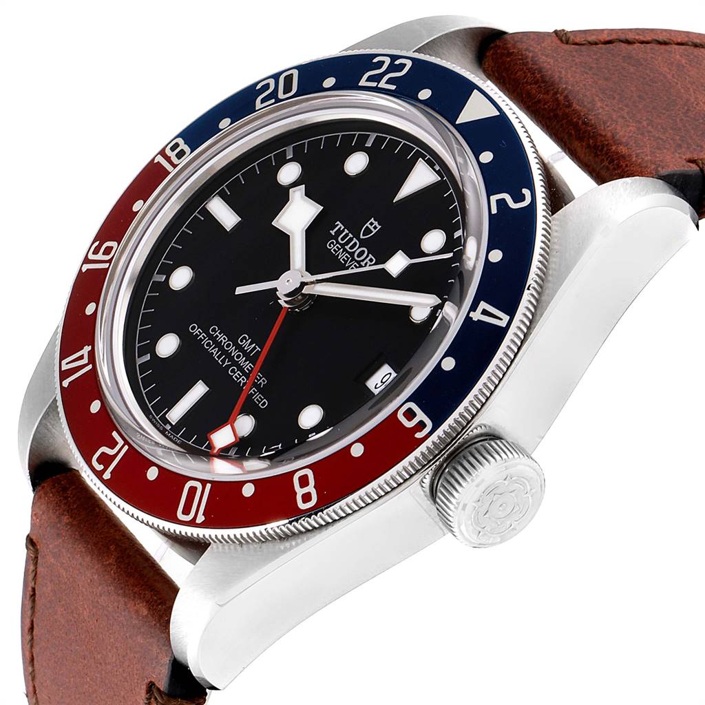 The Tudor Heritage Black Bay 79830RB Men's Stainless Steel Black Dial 79830RB Men's Stainless Steel Black Dial watch is shown at a three-quarter angle, highlighting its bezel, crown, and dial with a brown leather strap.