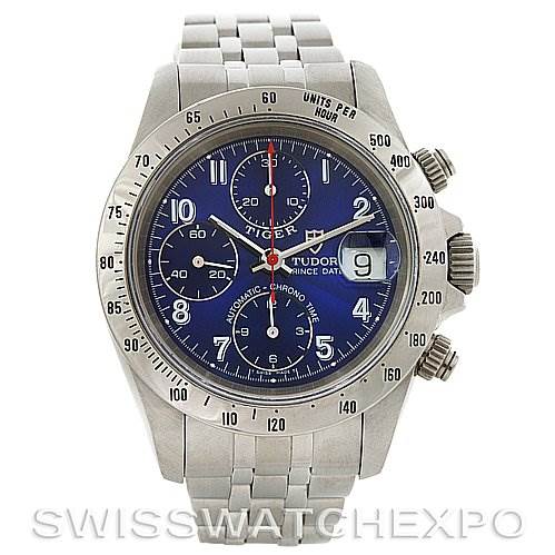 The image shows a Tiger model watch by Tudor, captured from a frontal angle, highlighting the dial, bezel, and bracelet.