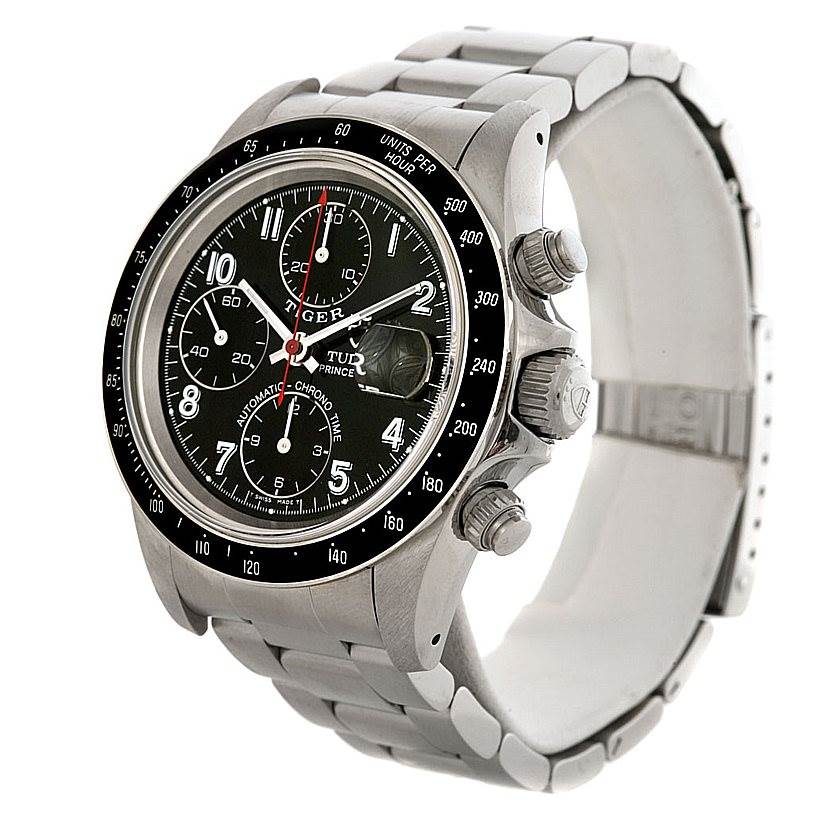 The image shows a Tudor Prince watch at a three-quarter angle, displaying the face, crown, pushers, and part of the bracelet.