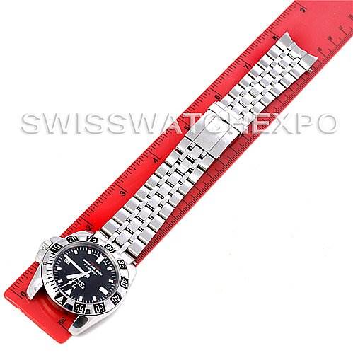 The image shows a top-down view of a Tudor Hydronaut 20030 Men's Stainless Steel Black Dial 20030 Men's Stainless Steel Black Dial watch with its bracelet laid out and measured against a red ruler.