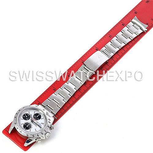 The Tudor Tiger 79280 Men's Stainless Steel White Dial 79280 Men's Stainless Steel White Dial model watch is shown from a top-down angle, highlighting its full bracelet and face placed along a red ruler.